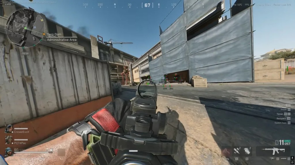 Green player name labels visible through a doorway at the Zero Dam administrative area.
